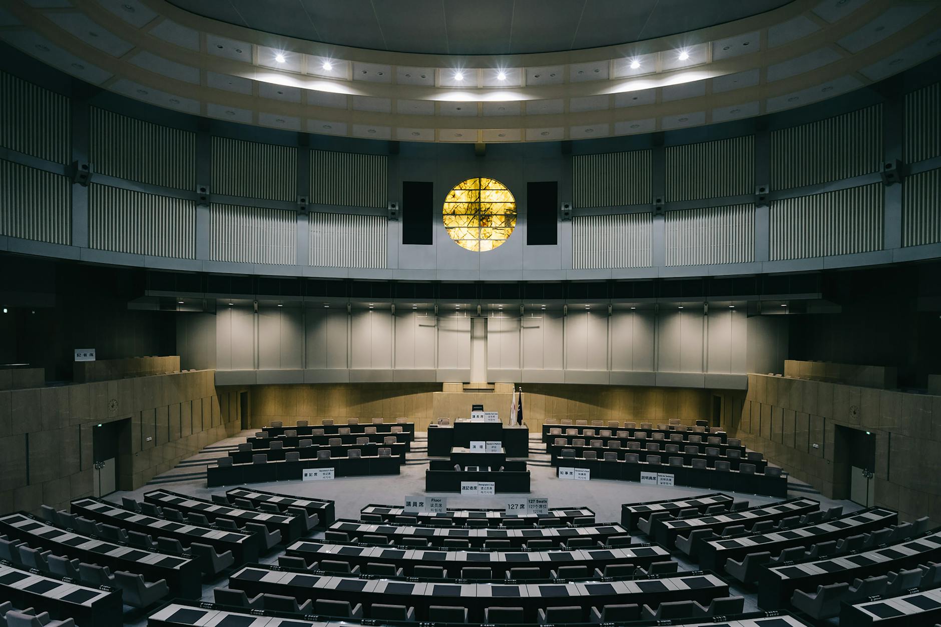 a large empty room with a large round table